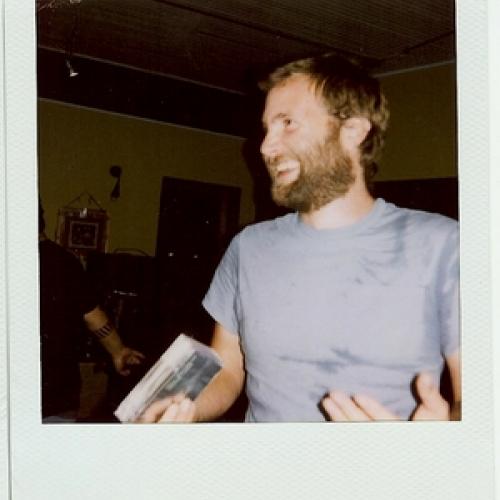 Paul Baribeau smiling in a Polaroid photo