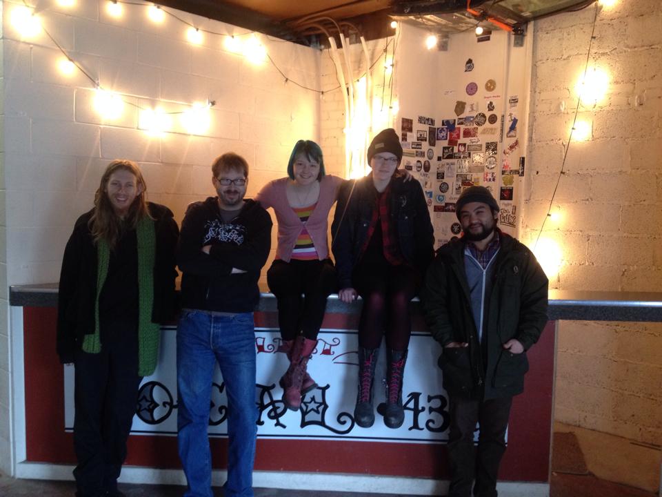 Group photo smiling inside the Flint Local 432 space