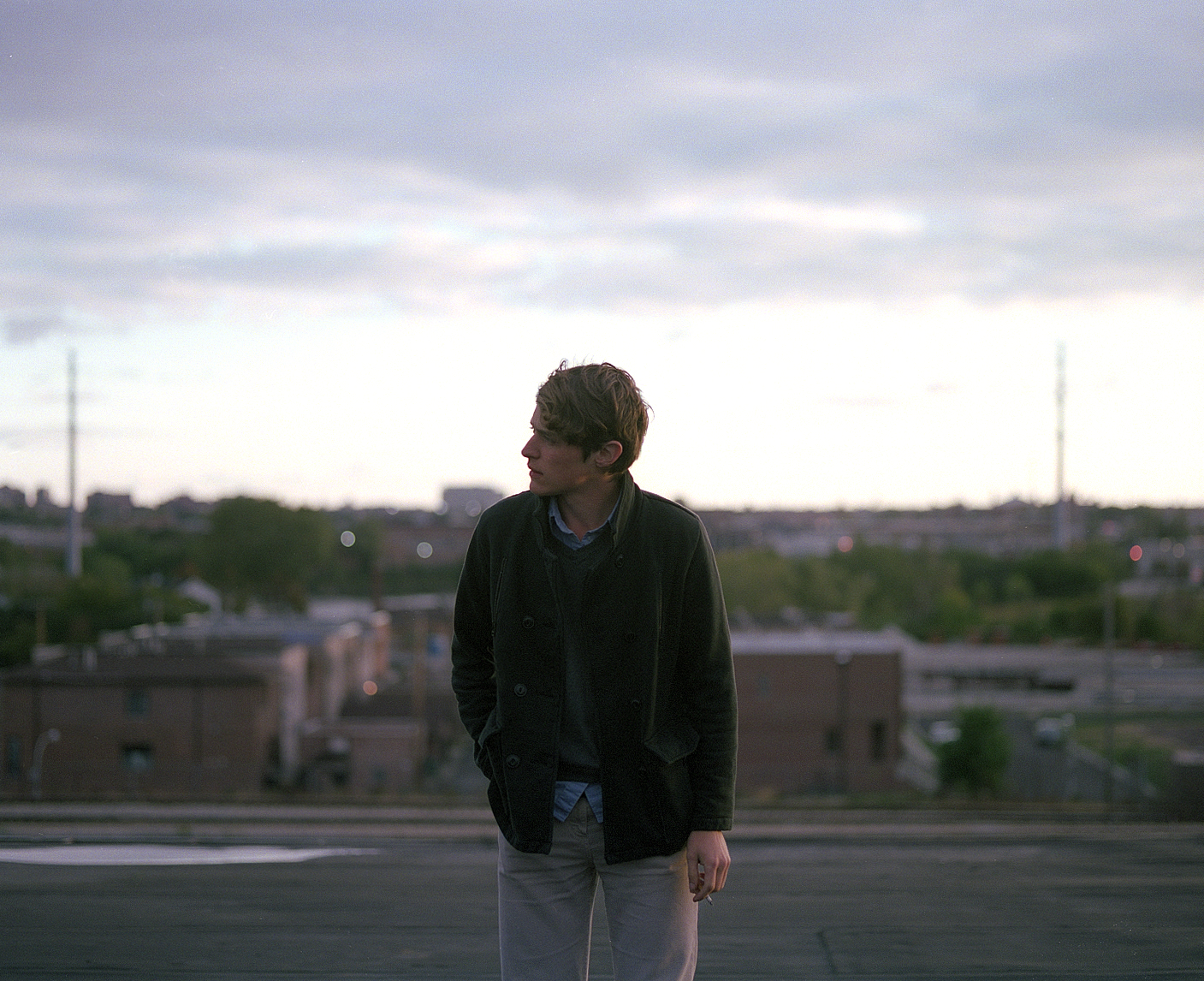 man smoking on a rooftop