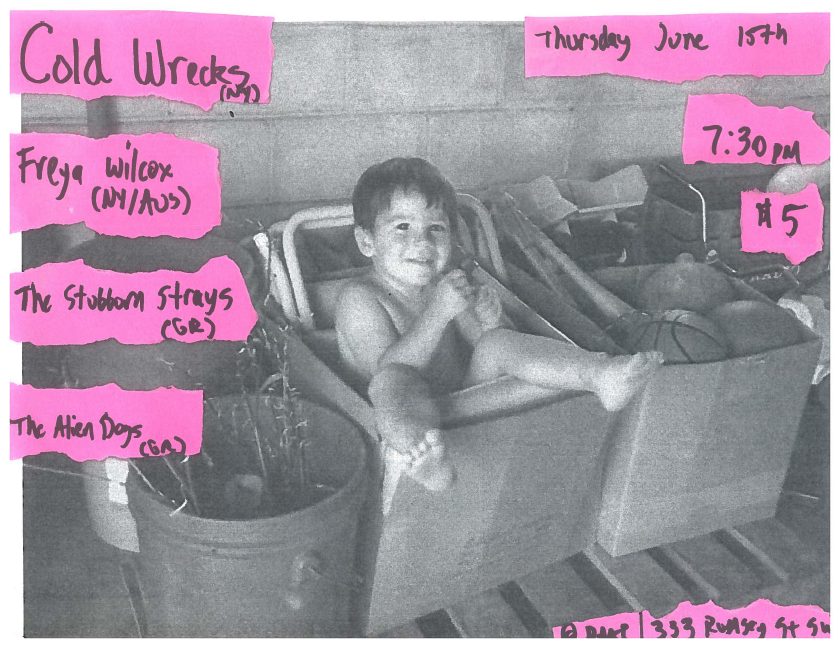 Fuzzy black and white photograph of a kid sitting in a cardboard box