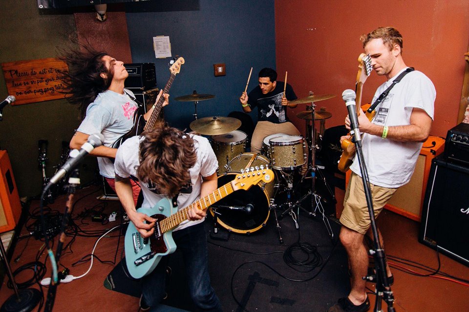 Four musicians shredding