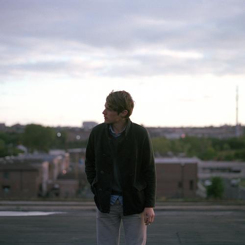 man smoking on a rooftop