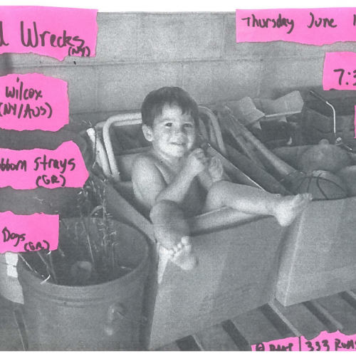 Fuzzy black and white photograph of a kid sitting in a cardboard box