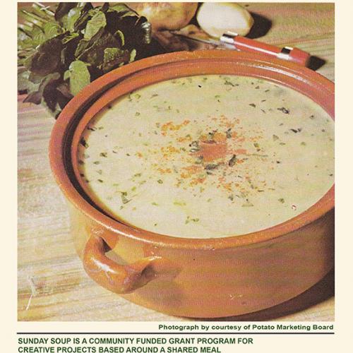 Retro photograph of a large ceramic pot of creamy soup