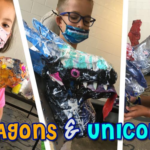 three children show off their paper mache creatures